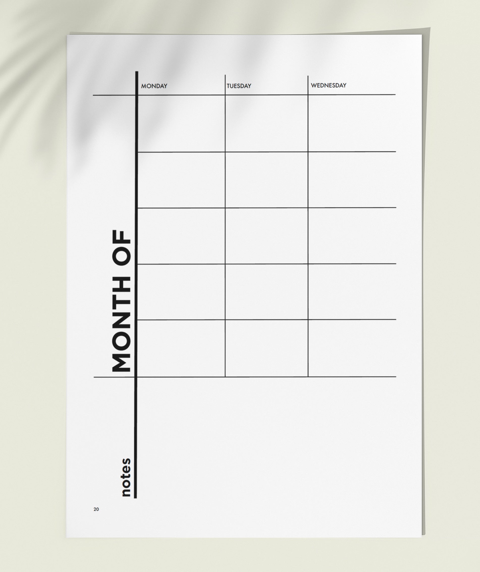 MSTRPLN printable planner showing the Undated Monthly overview page on top of a neutral table. 