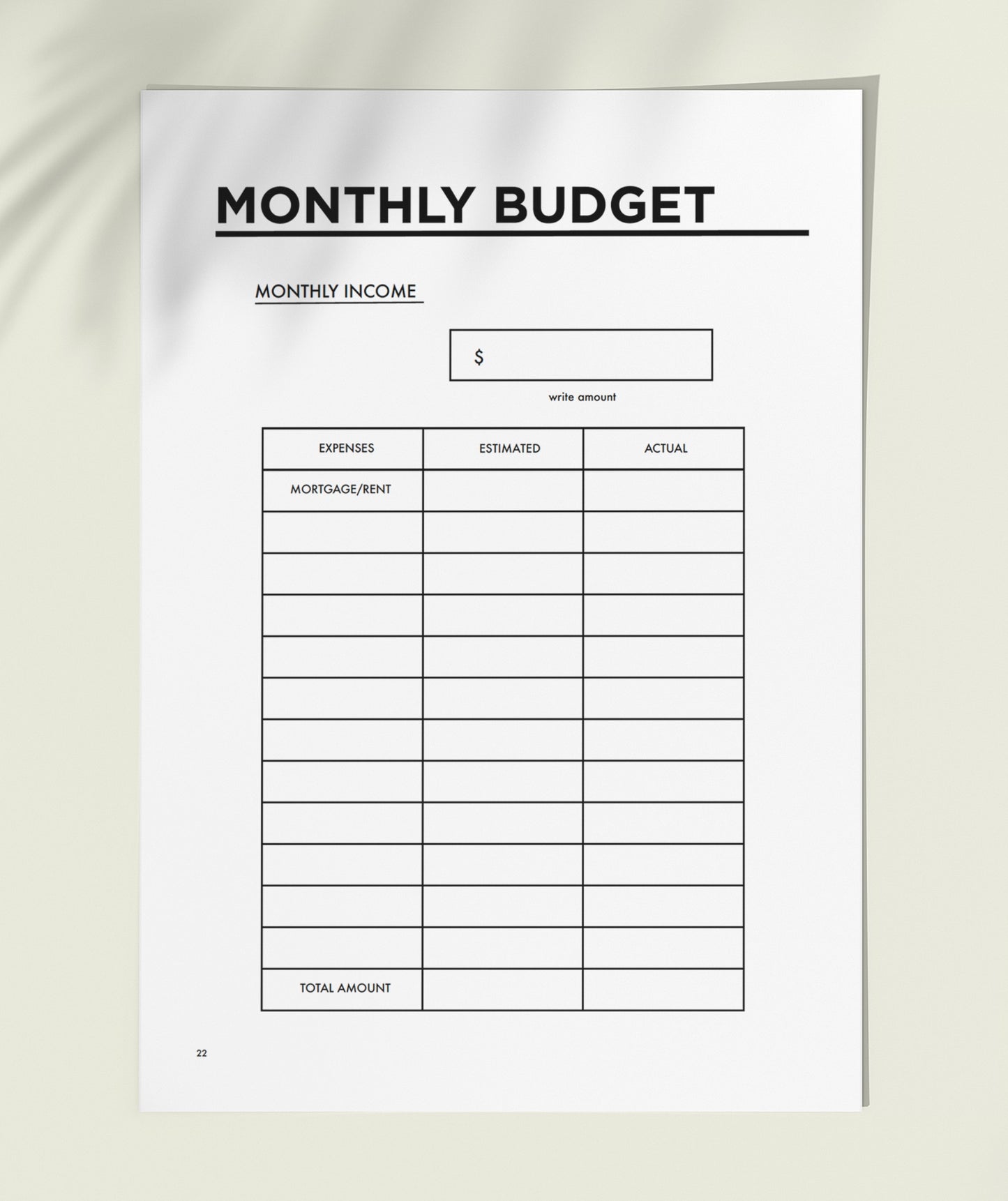 MSTRPLN printable planner showing the monthly budget page on top of a neutral table. 